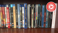 A selection of Blu-rays on a shelf with the press play logo overlaid