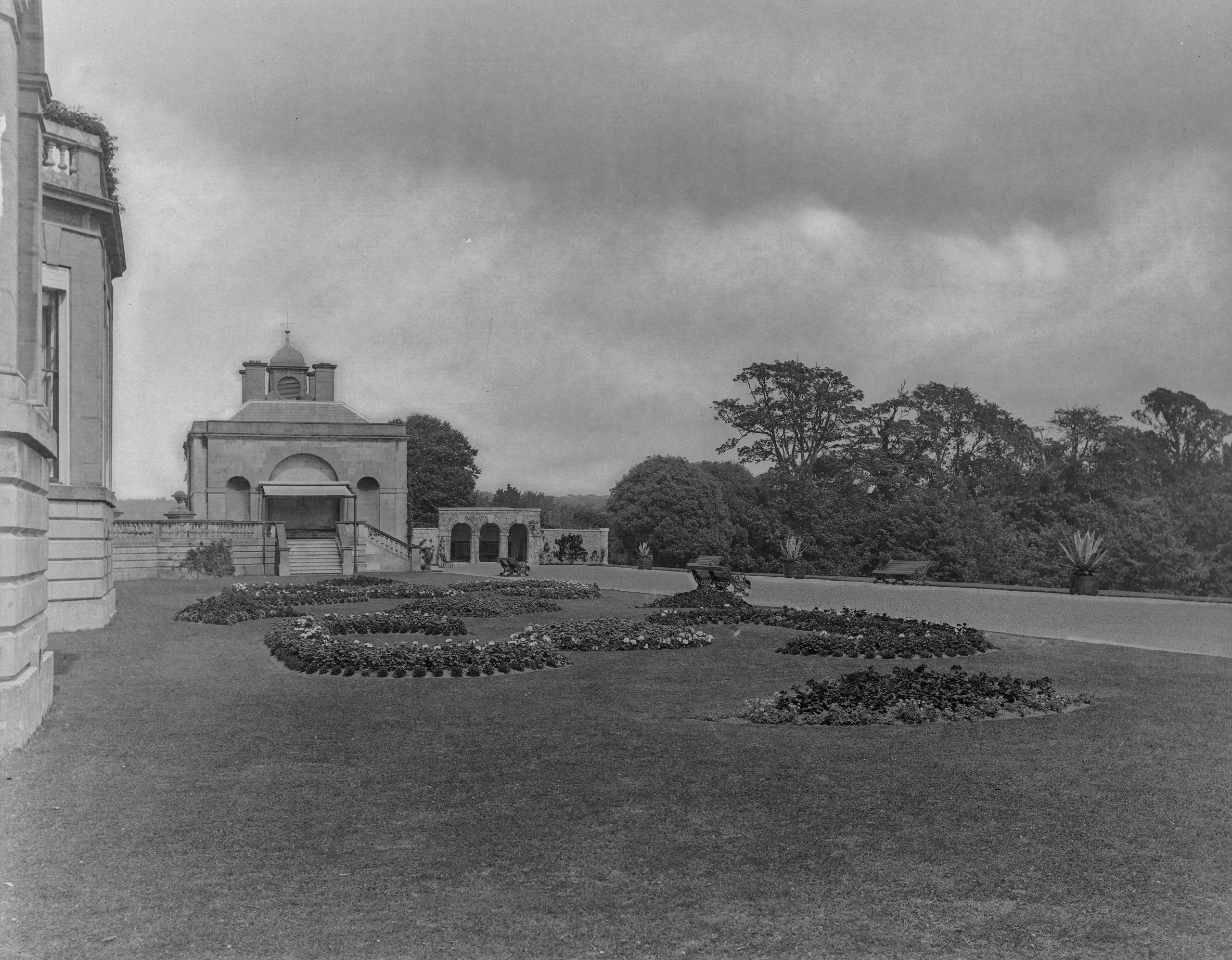 Black-and-white photographs of a neo-Palladian manor house