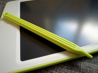 A green and white Richgv LCD Tablet with a green pen