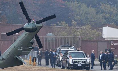 Donald Trump waits for his helicopter.