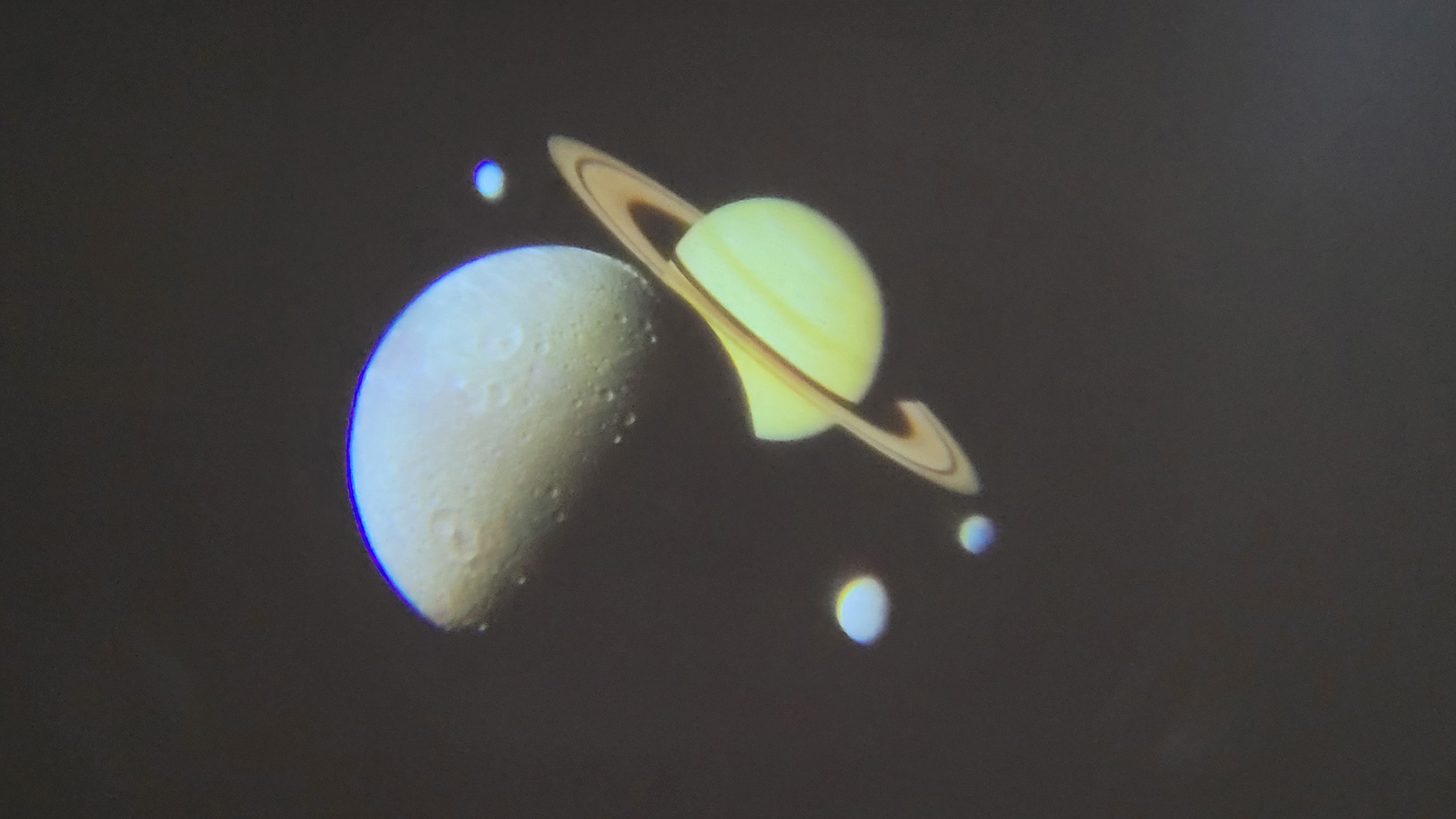 Image shows a projection of planets