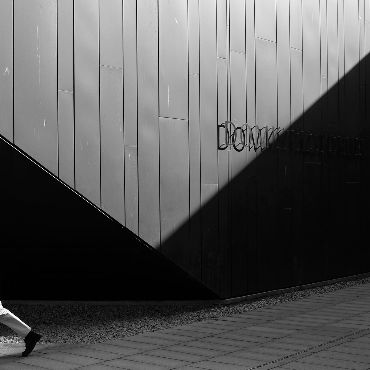 Angular shadow on a wall sign