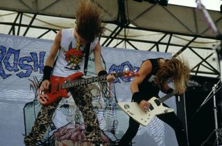 Jason Newsted (left) and James Hetfield perform onstage with Metallica at Castle Donington in Donington, England on August 22, 1987