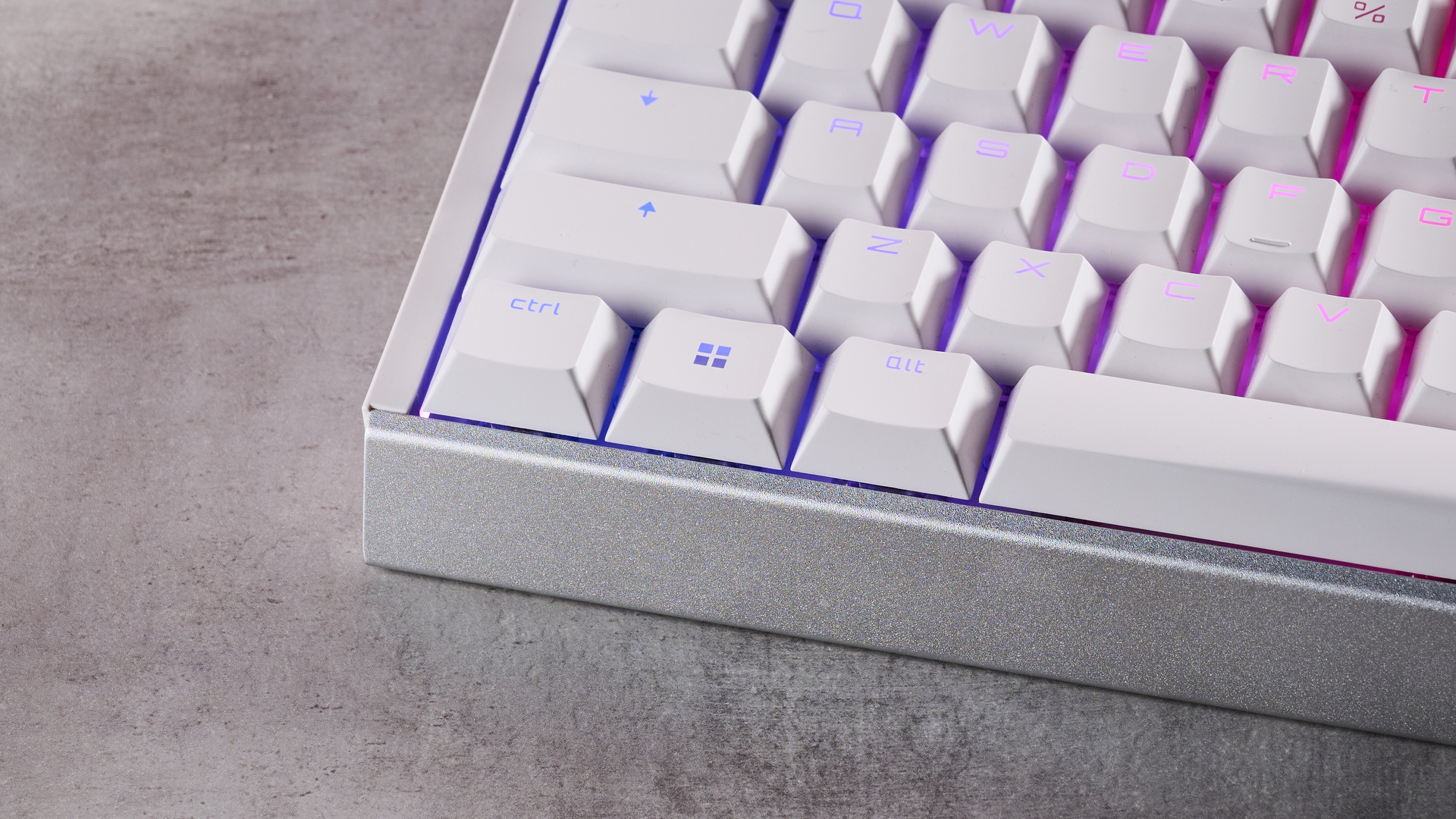 Close-up of bottom left corner of Cherry XTRFY MX 3.1 with RGB lighting on