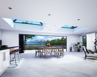 Korniche bifold doors and roof lantern lifestyle imagery open plan white apartment with views
