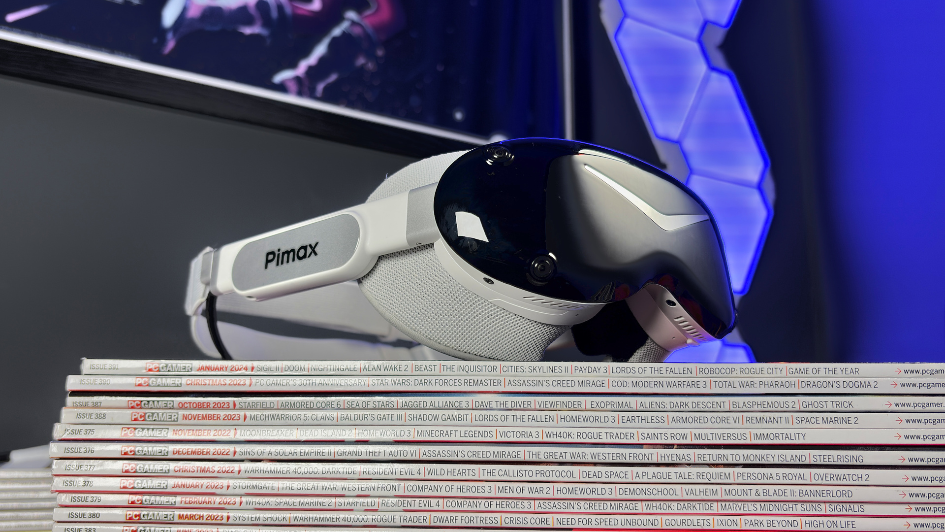 The Pimax Dream Air in white on a stack of PC Gamer magazine.