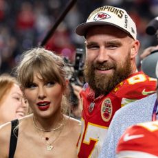 Travis Kelce #87 of the Kansas City Chiefs and Taylor Swift