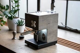 concrete coffee machine by AnZa on bench with pot plants