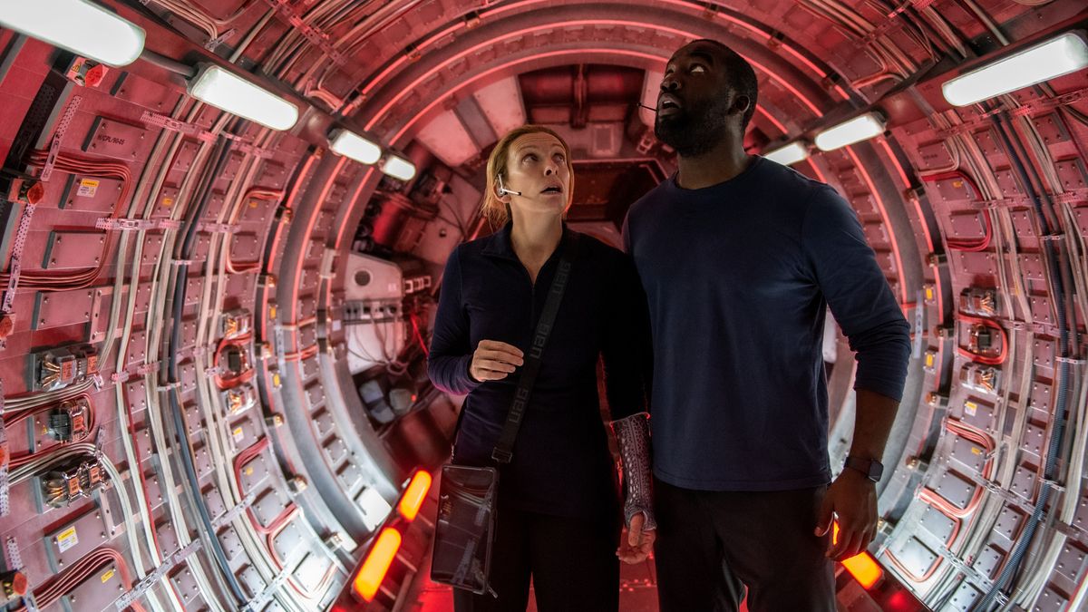 Tony Collete as Cmdr. Marina Barnett and Shamier Anderson as Michael Adams in "Stowaway" on Netflix.