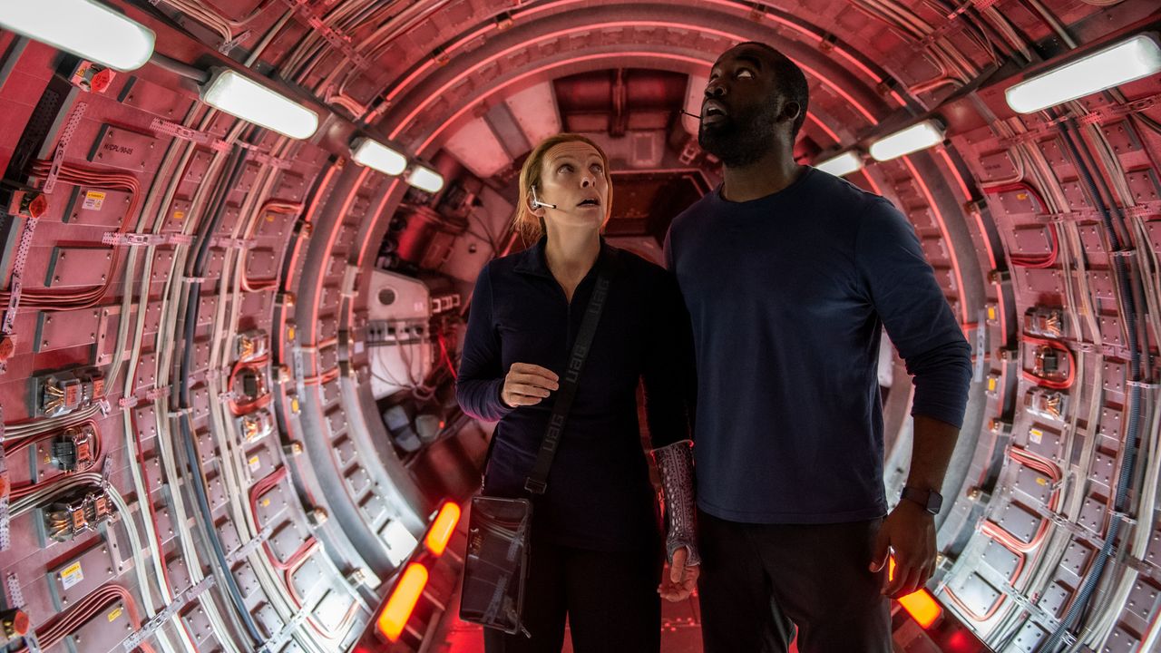 Tony Collete as Cmdr. Marina Barnett and Shamier Anderson as Michael Adams in "Stowaway" on Netflix.