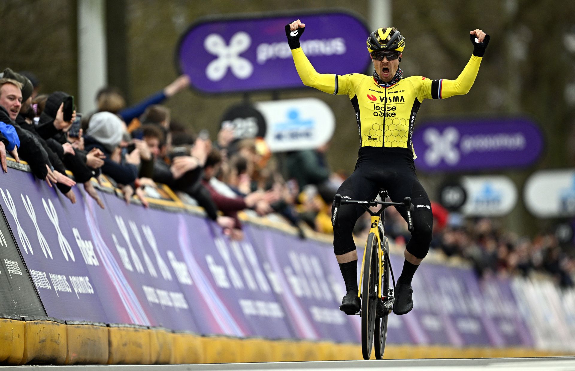 Photo shows Jan Tratnik winning the 2024 Omloop Het Nieuwsblad