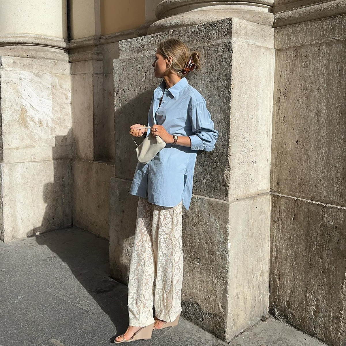 an influencer wears a blue button-down shirt