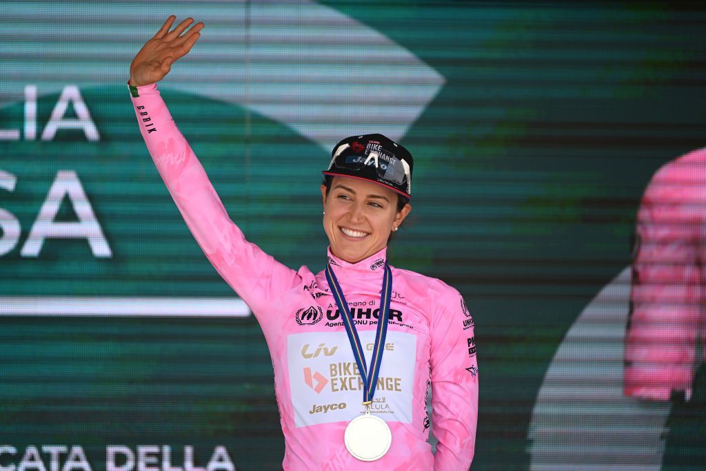 CAGLIARI ITALY JUNE 30 Kristen Faulkner of United States and Team BikeExchange Jayco celebrates at podium as pink leader jersey winner during the 33rd Giro dItalia Donne 2022 Stage 1 a 47km individual time trial stage from Cagliari to Cagliari ITT GiroDonne UCIWWT on June 30 2022 in Cagliari Italy Photo by Dario BelingheriGetty Images