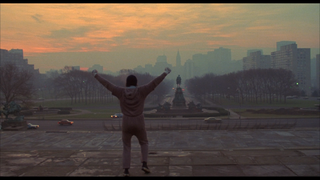 Rocky celebrates at the top of some Philadelphia-based steps in his first film