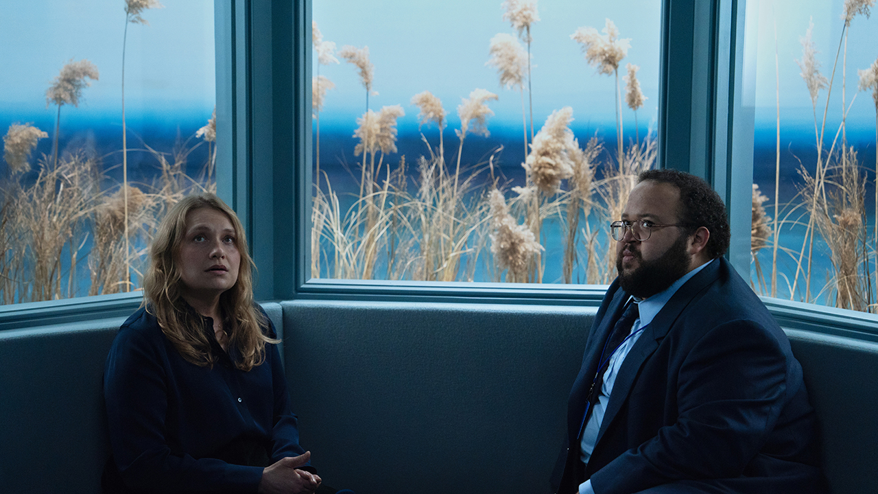 Gretchen and Dylan G sitting in the Outie Visitation Suite in Severance season 2 episode 6