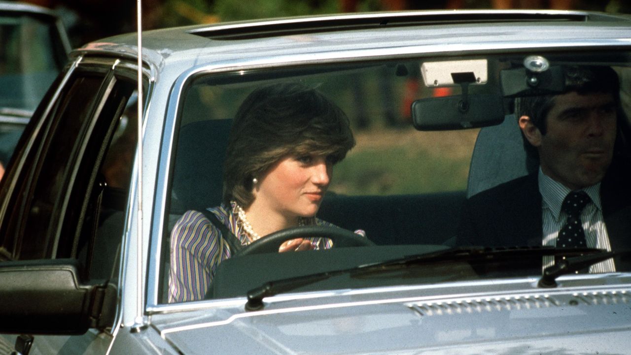 windsor, united kingdom june 16 lady diana spencer driving her ford escort car at the guards polo club bodyguard colin trimming accompanies her photo by tim graham photo library via getty images