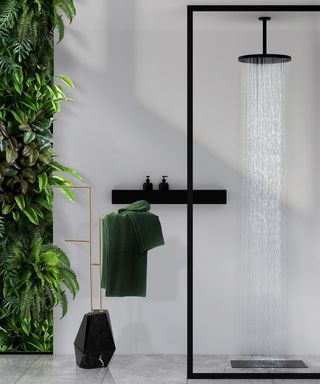 Tropical black bathroom design with living wall by Maison Valentina