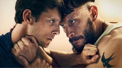 Jamie Bell and Richard Gadd hold each other in an awkward grip