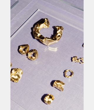 gold jewellery on surface
