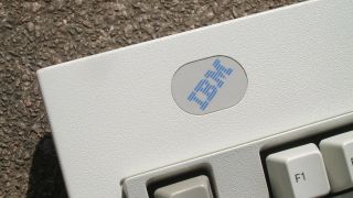 IBM Model M 1391406 (Greenock, UK ISO 1996) — blue label IBM logo in the top right of the keyboard.