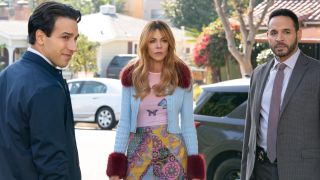 From left to right: Deniz Akeniz standing with his back to the camera, Kaitlin Olson looking forward and standing next to Daniel Sunjata. 