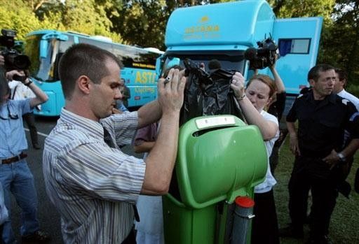 Palmeraie Hotel staff remove rubbish from bins