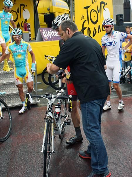 Lance Armstrong (Team Radioshack) had a team staff member with him to hold his bike and ease his passage through the crowds.