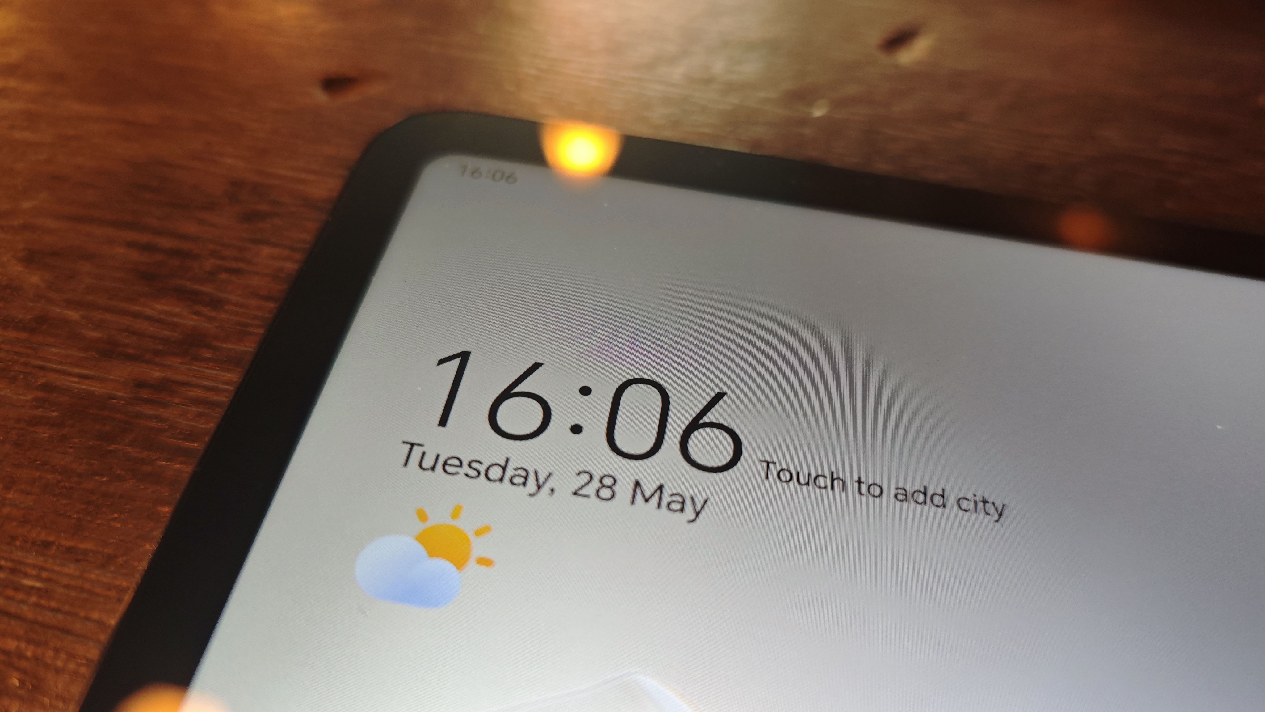 A SPace Grey Honor Pad 9 tablet on a brown table