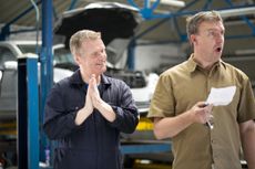 a picture of a man surprised by a car repair bill