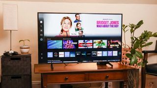 Samsung DU8000 LED TV on console in living room