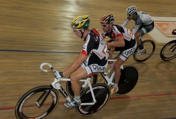 Team ouch excanges as Ryan Luttrell (Black Dog Pro Cycling) comes around