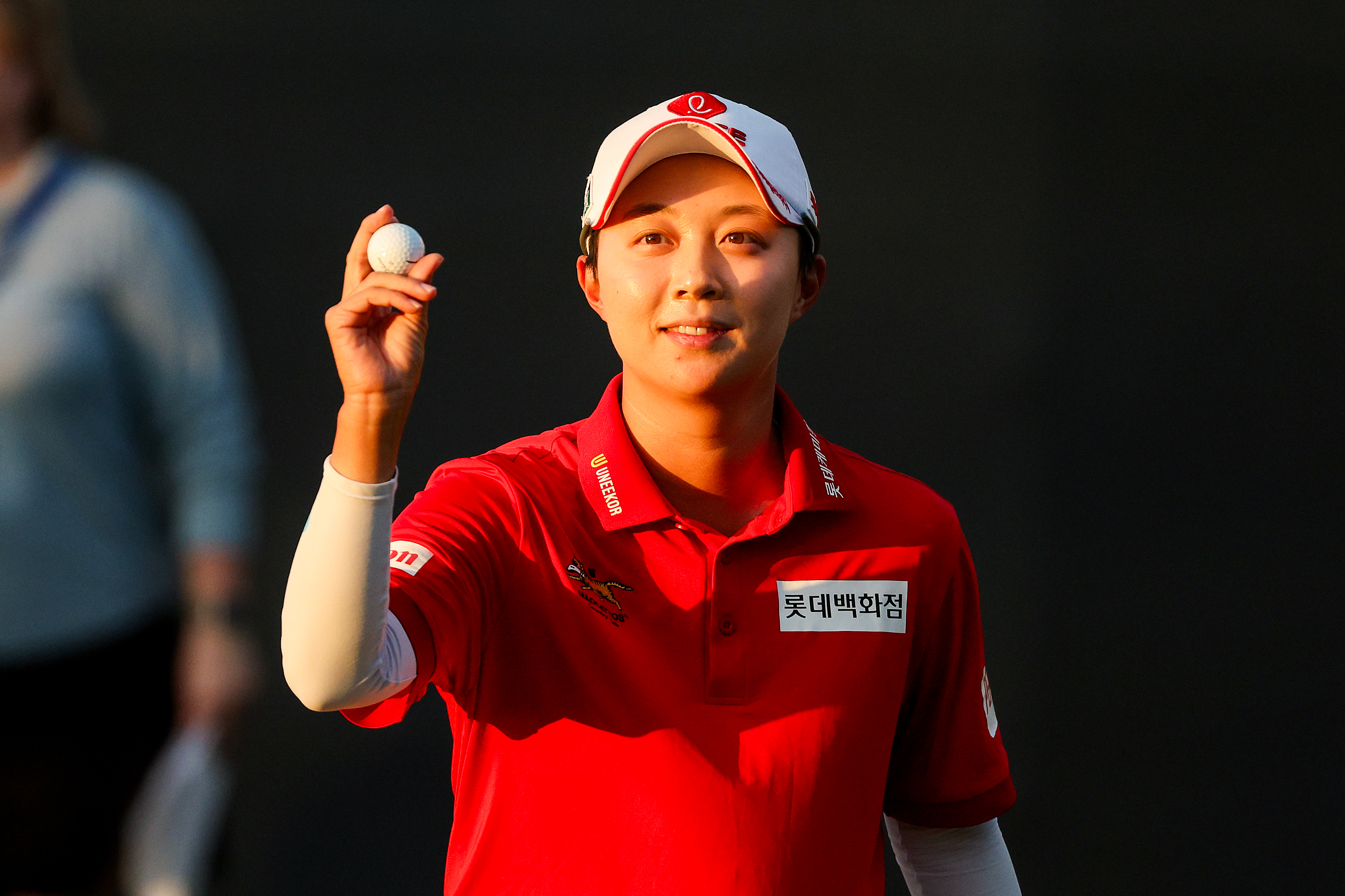 Hyo Joo Kim holds her golf ball up after winning the 2025 Ford Championship