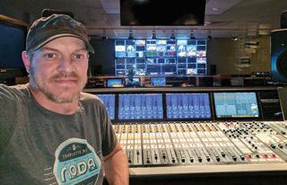 Senior audio mixer for the WCCB-TV morning show, Richard England, is shown here in front of the Dimension Three Touch audio console.