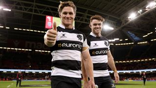 Barbarians players give the thumbs up on the pitch in Cardiff