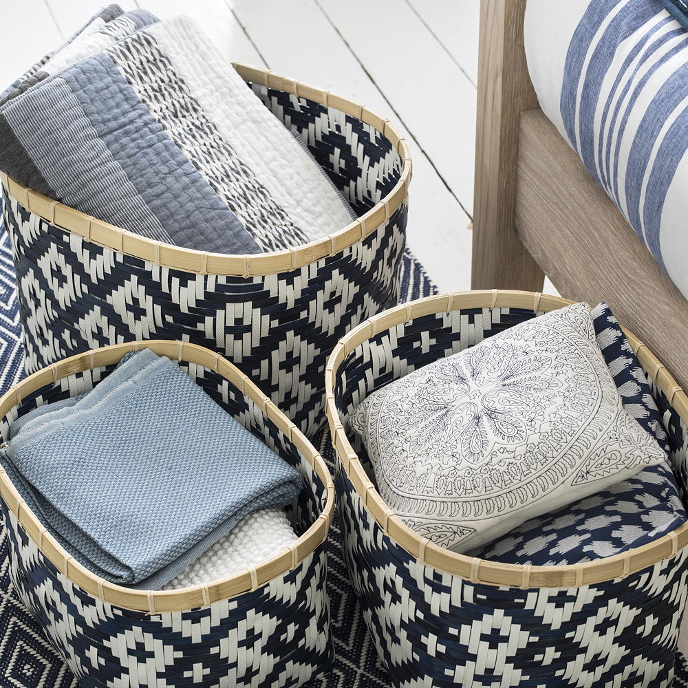 bedroom with wooden flooring and basket with cloths
