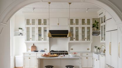 White kitchen with interior arches
