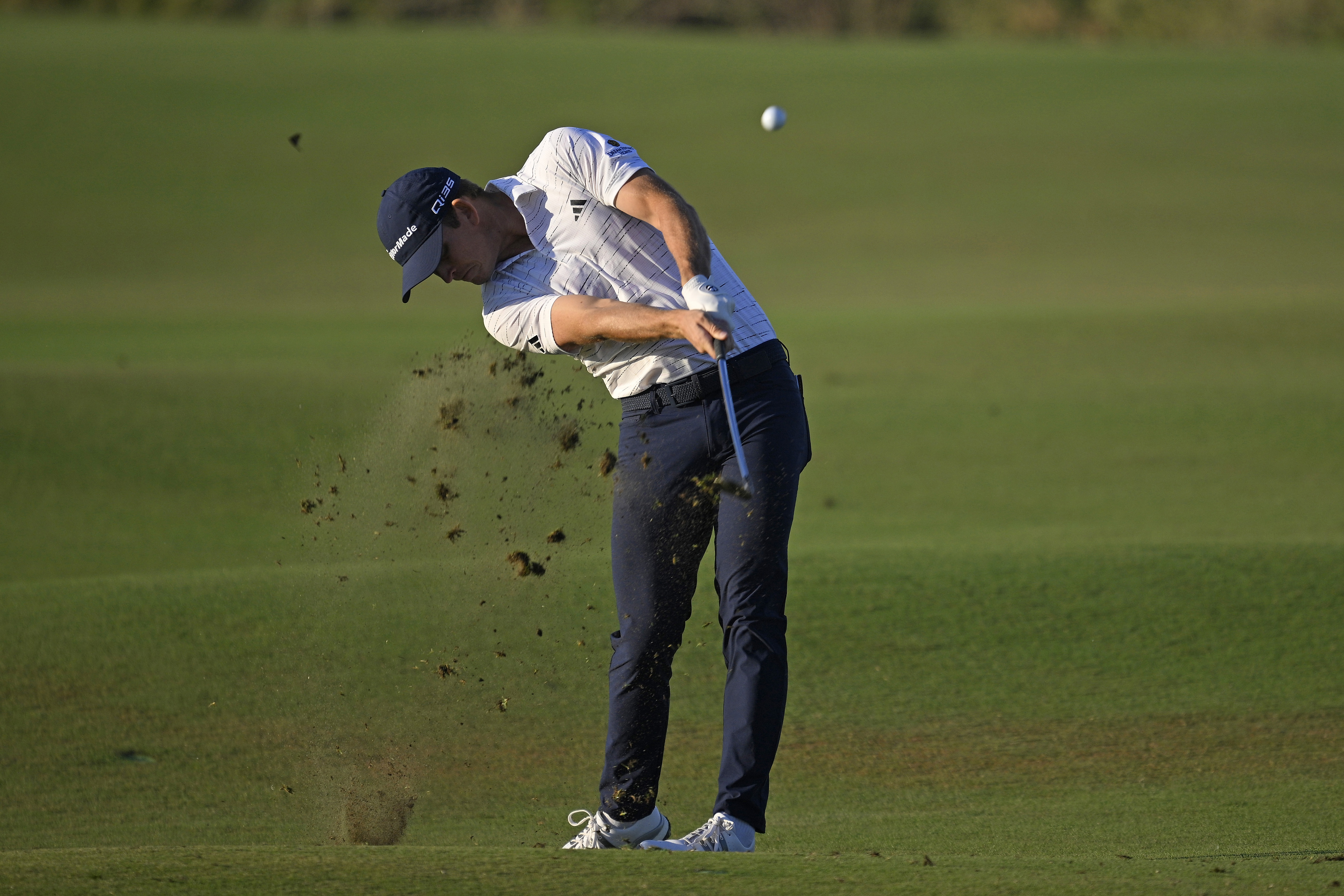 Jacob Bridgeman hits an iron shot