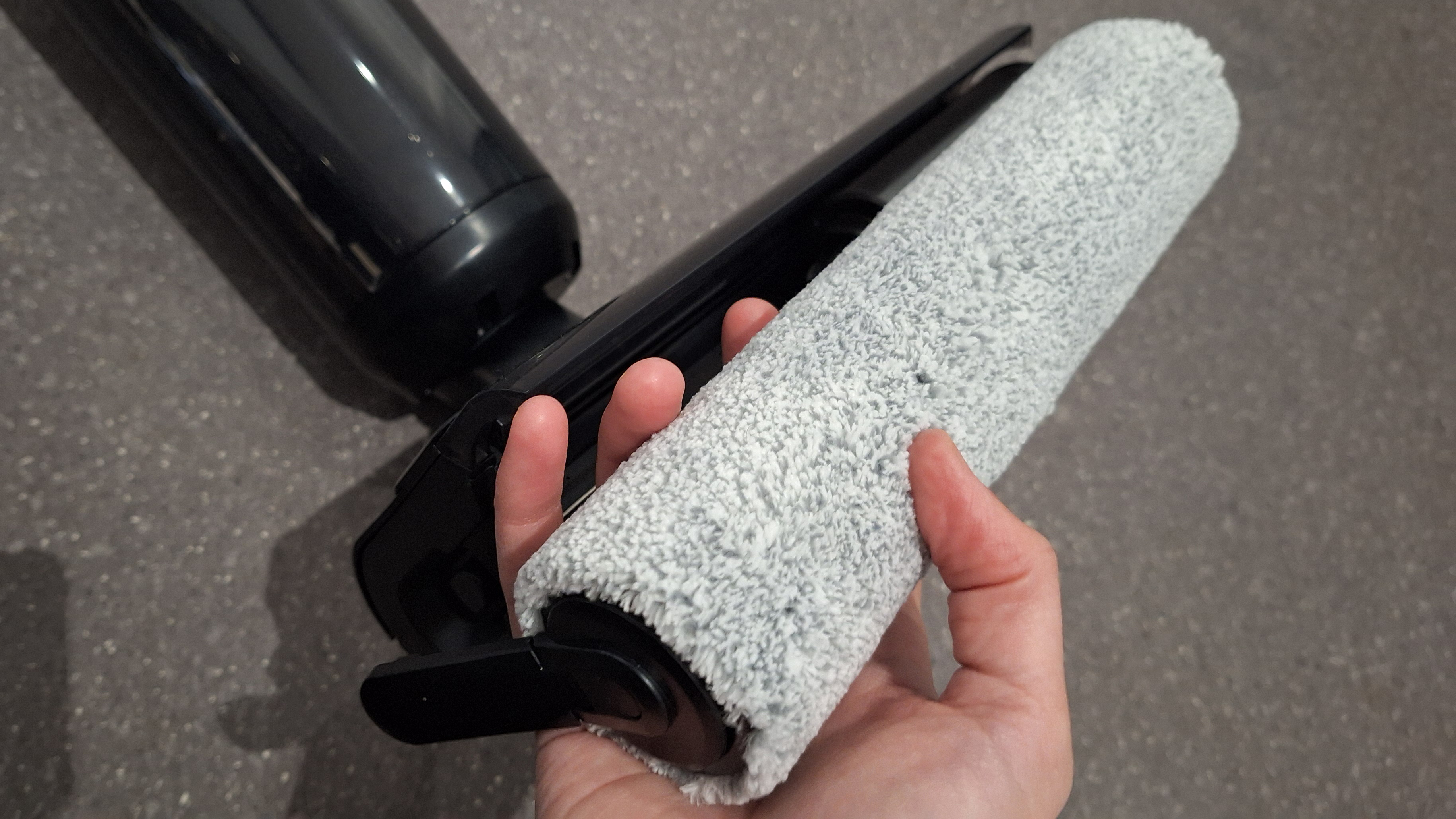 Hoover HW3 roller removed and held in tester's hand