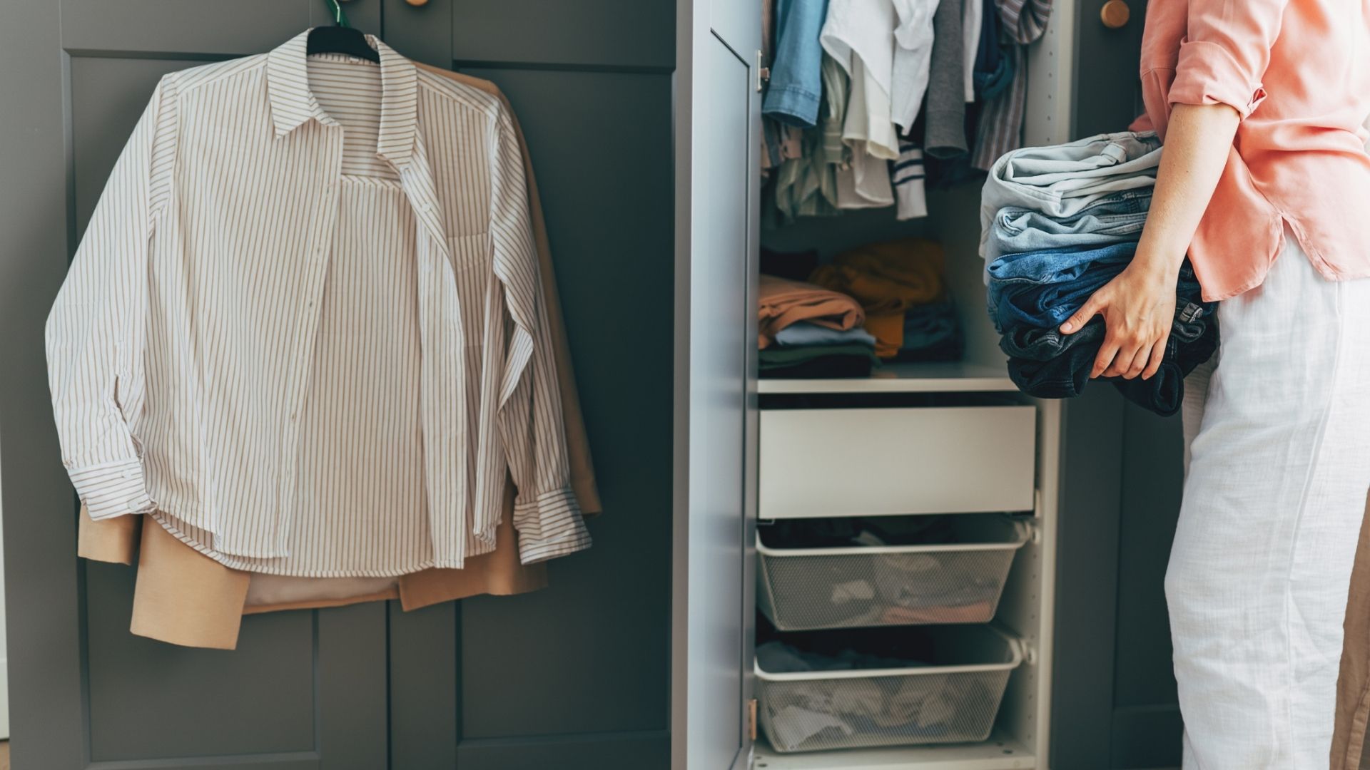 The image shows a woman putting folded laundry into a wardrobe