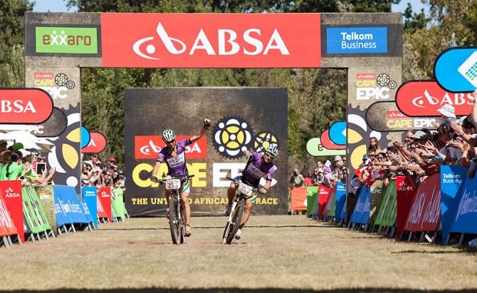 Grand Masters winners Heinz Zoerweg (L) and Barti Bucher (R) cross the line of the final stage