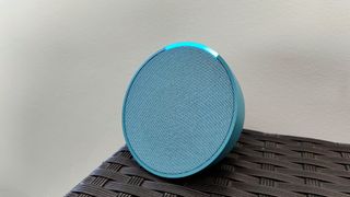 Amazon Echo Pop review: blue speaker with Alexa light strip lit up
