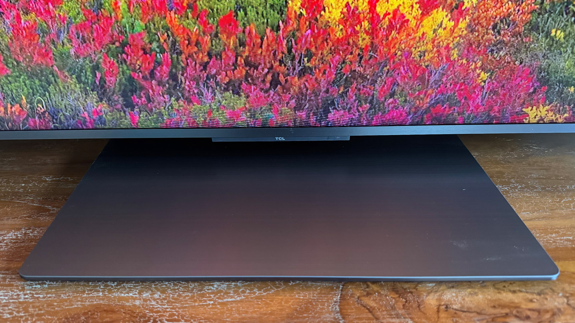 The 65-inch TCL C7K Mini LED TV photographed in a living room