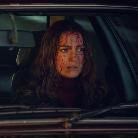 Ben Whishaw as Sam and Keira Knightley as Helen, sitting in the front seats of a British car (with blood on Helen's face), in 'Black Doves.'