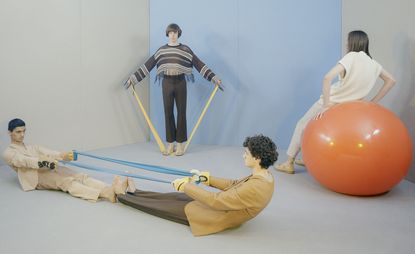 group of men using exercise equipment 