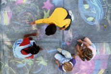 image of children coloring with chalk