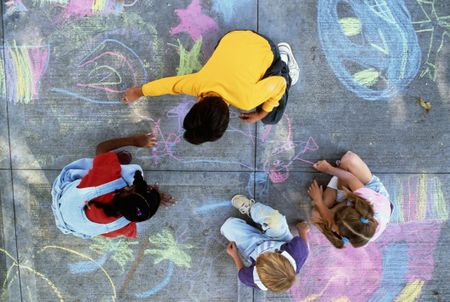 image of children coloring with chalk