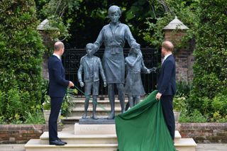 Prince William, Duke of Cambridge (left) and Prince Harry, Duke of Sussex unveil a statue they commissioned of their mother Diana, Princess of Wales