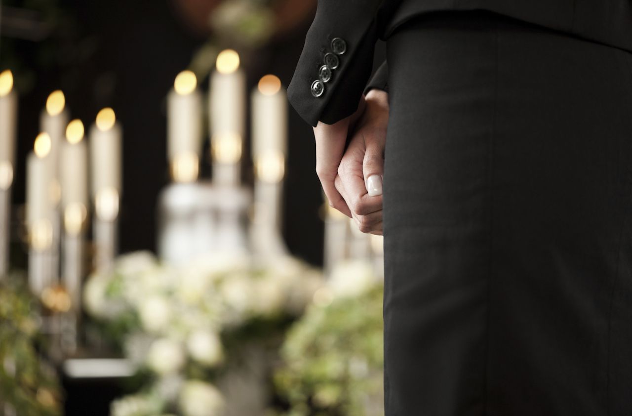 woman at funeral mourning