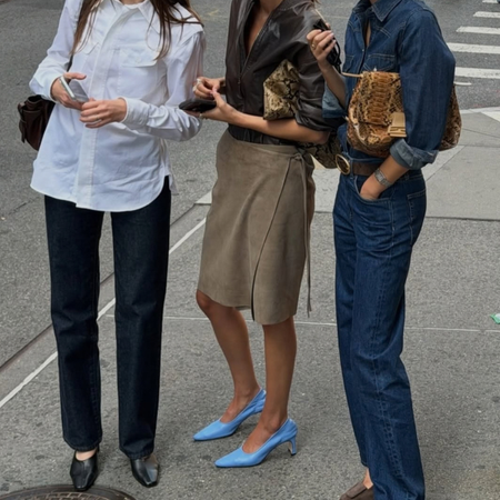 An image of three New York influencers wearing autumn outfits and autumn trends, like tuxedo shirts, jeans and heels