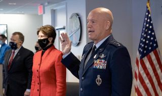 Gen. Jay Raymond, Chief of Space Operations for the U.S. Space Force, administers the oath of enlistment to Col. Michael Hopkins, a NASA astronaut aboard the International Space Station, during a ceremony held from NASA Headquarters in Washington, D.C. on Friday, Dec. 18, 2020. Barbara Barrett, Secretary of the Air Force, also attended the history-making event.